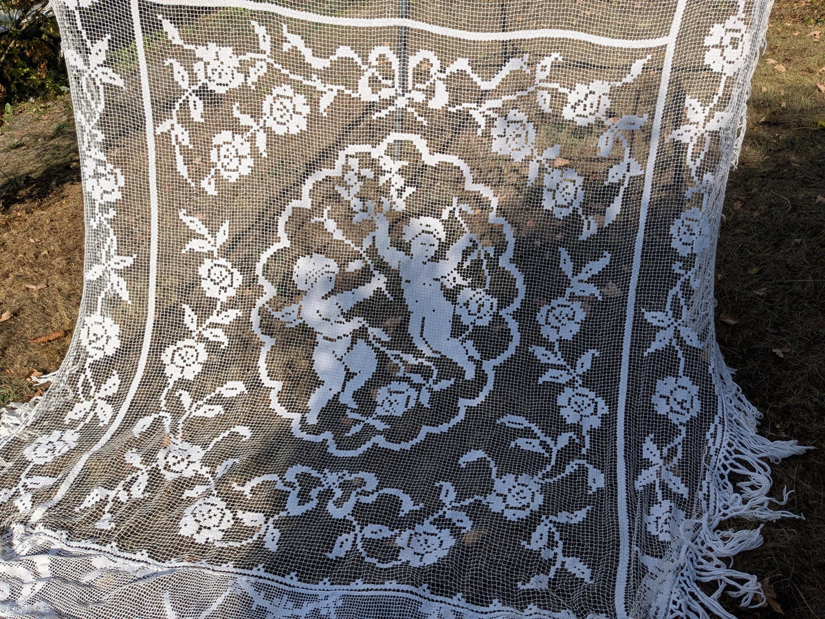 Antique French filet lace lace bed cover or drape with cherubs