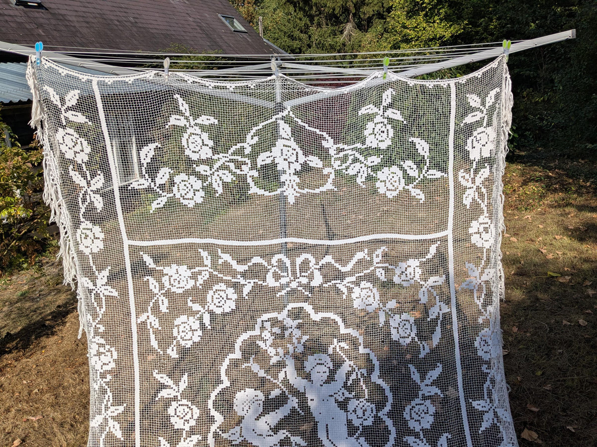 Antique French filet lace lace bed cover or drape with cherubs