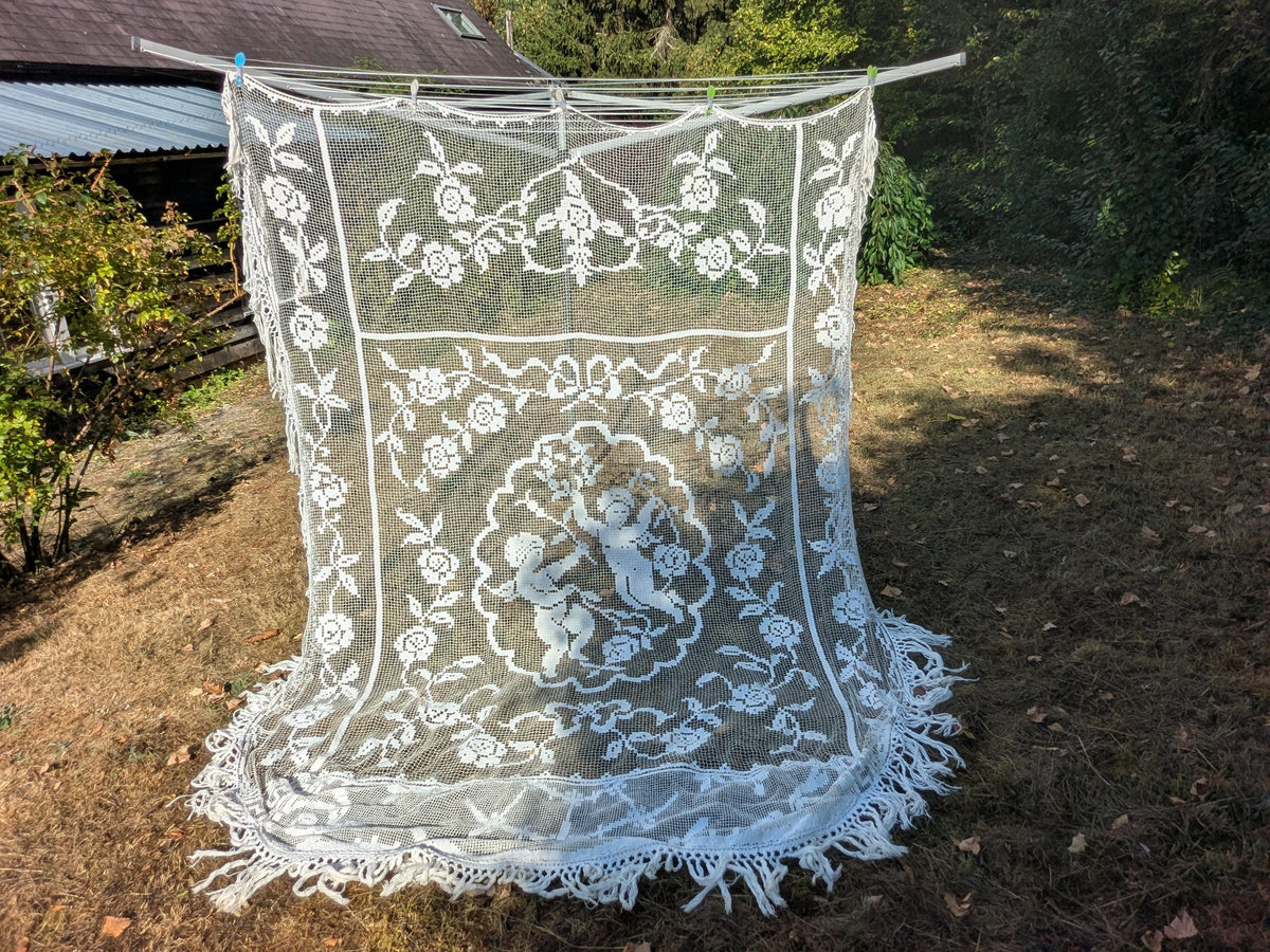 Antique French filet lace lace bed cover or drape with cherubs