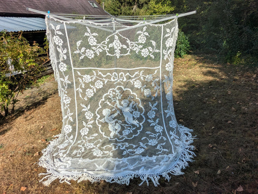 Antique French filet lace lace bed cover or drape with cherubs