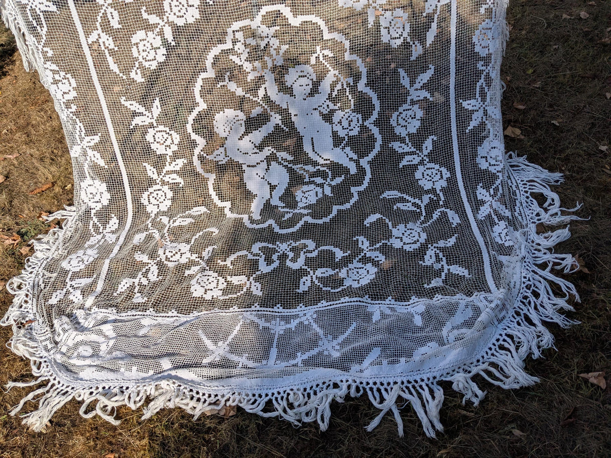 Antique French filet lace lace bed cover or drape with cherubs