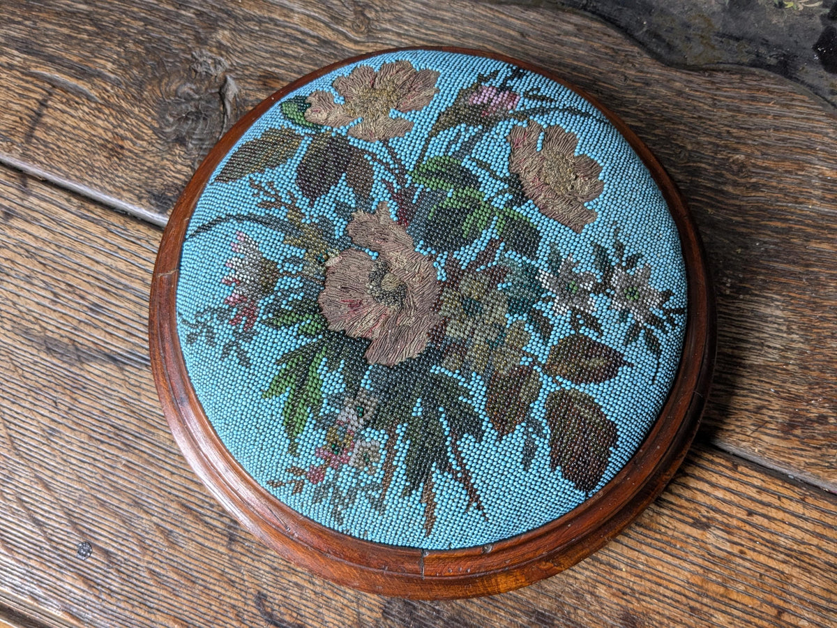 Antique footstool, beaded upholstered top